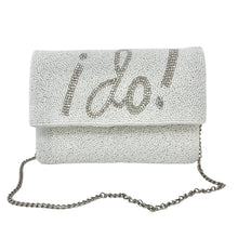 Load image into Gallery viewer, Elegant white clutch with sparkling beads, featuring the words &quot;I Do!&quot; in bold, silver lettering. It has a silver chain, conveying a bridal theme.