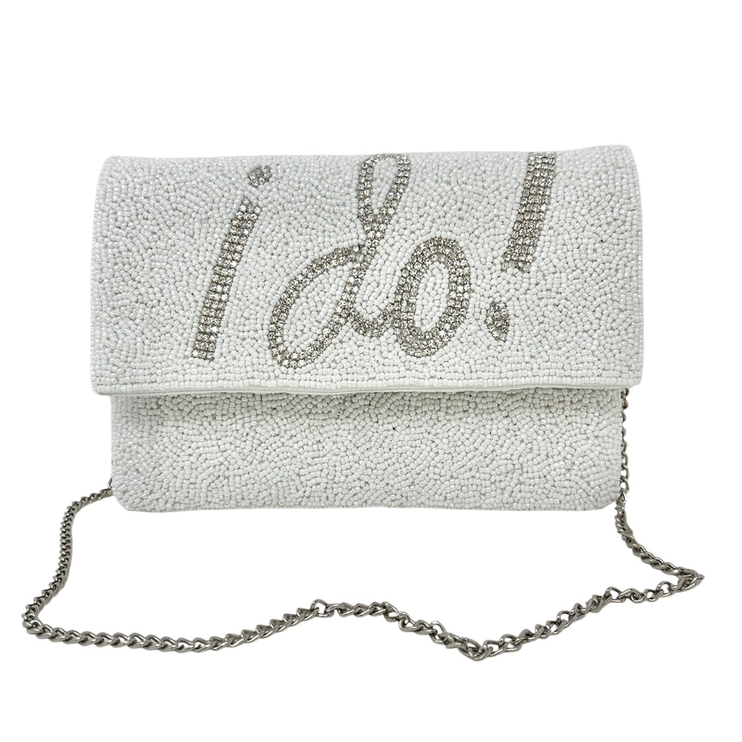 Elegant white clutch with sparkling beads, featuring the words 
