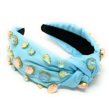 Load image into Gallery viewer, Fashion portrait featuring a jeweled pastel blue headband and vibrant beaded bird drop earrings in natural sunlight.