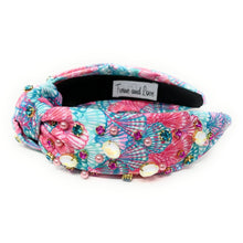 Load image into Gallery viewer, headband featuring tropical floral prints, sparkling blue crystals, and pink pearl embellishments.