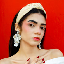 Load image into Gallery viewer, Elegant sand-colored fabric headband with a classic knot detail and comfortable padded silhouette for effortless wear.