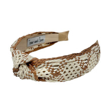 Load image into Gallery viewer, A raffia woven headband with a monochrome ivory and brown pattern, featuring a knotted design.