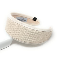 Load image into Gallery viewer, Tan and brown woven headband with textured pattern, lying on a white surface. The headband exudes a casual, earthy elegance.