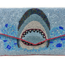 Load image into Gallery viewer, Handmade shark statement clutch covered in intricate blue beadwork with wave accents and envelope flap closure.