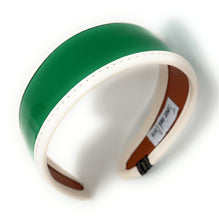 Load image into Gallery viewer, Shiny green statement headband featuring a sleek patent surface and cream-colored edging.
