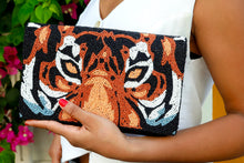 Load image into Gallery viewer, Statement beaded envelope clutch showcasing an artistic tiger portrait with bold eyes and intricate beadwork.