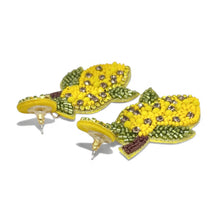 Load image into Gallery viewer, Lemon fruit statement earrings with detailed handcrafted bead embroidery, shimmering rhinestones, and green leaf accents on a neutral background.