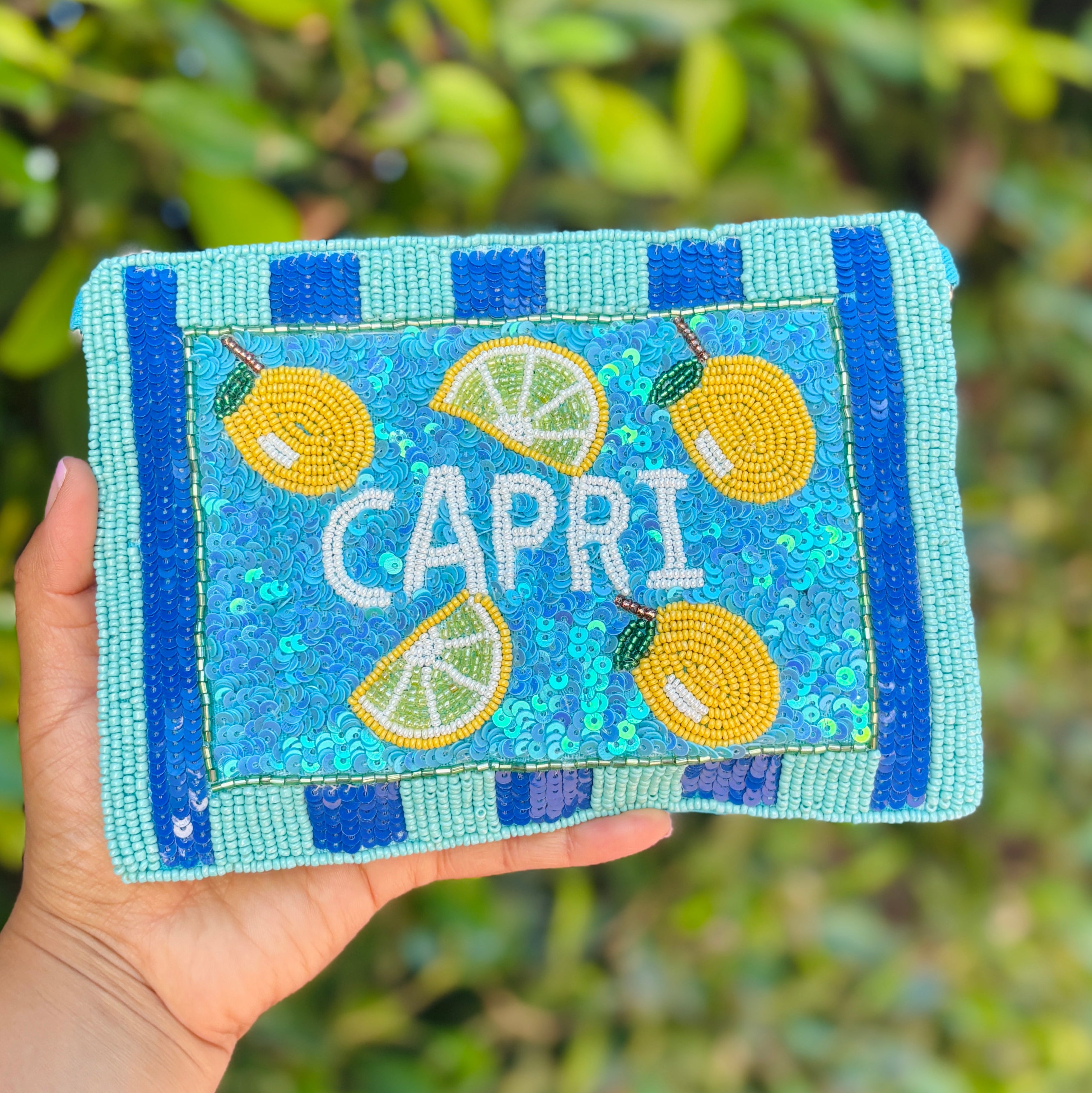 Small beaded zipper pouch decorated with lemons, lime slices, and sparkling turquoise sequins.