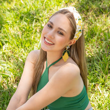 Load image into Gallery viewer, White knotted headband with embroidered yellow lemons, green leaf details, and sparkling gold bead accents.