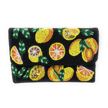 Load image into Gallery viewer, Hand-beaded citrus clutch with lemon and orange fruit design on black background