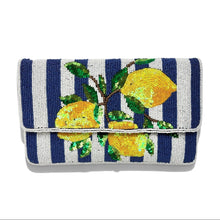 Load image into Gallery viewer, Hand beaded lemon clutch with yellow lemons and green leaves on a navy and white striped background