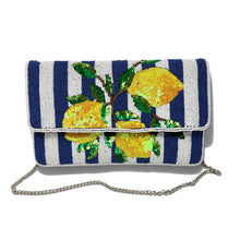 Load image into Gallery viewer, Hand beaded lemon clutch with yellow lemons and green leaves on a navy and white striped background