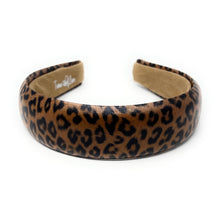 Load image into Gallery viewer, A leopard print headband with a bold pattern in brown and black. The interior is lined with a soft beige material, offering a stylish and chic look.