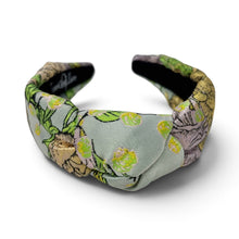 Load image into Gallery viewer, Close-up of women's floral fabric headband featuring an elegant twisted knot design.