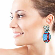 Load image into Gallery viewer, football Beaded Earrings, blue red football Earrings, football Earrings, XFL football, football earrings, Pittsburgh football earrings, liberty football, light blue red football earrings, cyan blue earrings, red light blue earrings, football seed bead earrings, football accessories, XFL accessories, Game day earrings, Best selling items, birthday gifts, sport jewelry, sport bead earrings, football accessory, College gifts, Football gifts for her, gameday earrings
