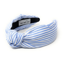 Load image into Gallery viewer, Blue and white striped headband with a knotted detail in the center, set against a plain white background, conveying a trendy, nautical style.