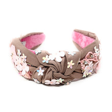 Load image into Gallery viewer, light Brown headband with pink interior, adorned with colorful floral applique and beading. The vibe is playful and feminine, showcasing detailed craftsmanship.