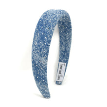 Load image into Gallery viewer, Blue glittery headband with a visible brand label on a white background