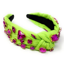 Load image into Gallery viewer, Statement fabric headband featuring vibrant fuchsia crystals on a bright lime green twisted silhouette.