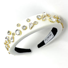 Load image into Gallery viewer, Padded white satin headband adorned with sparkling rhinestones and sophisticated evening-ready accents.