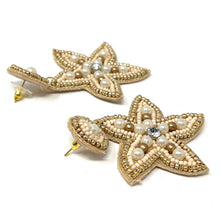Load image into Gallery viewer, Handmade beach-inspired drop earrings with starfish designs, pearl accents, and intricate gold embroidery.