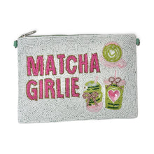 Load image into Gallery viewer, A rectangular zippered pouch with a textured light green beaded background, featuring the words 'MATCHA GIRLIE' in pink and green beaded letters, alongside illustrations of a matcha drink and a lollipop.
