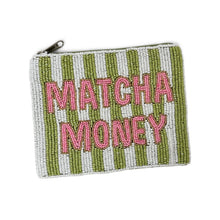 Load image into Gallery viewer, A small rectangular zip pouch covered in white and olive green beaded stripes, with the words "MATCHA MONEY" in pink beaded letters across the front. A silver zipper pull is visible at the top left.