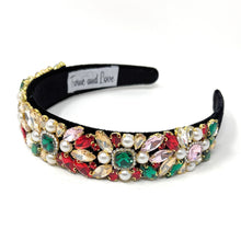 Load image into Gallery viewer, A jeweled headband with colorful gems in red, green, and pink, adorned with pearls on a black base, exudes an elegant and luxurious feel.