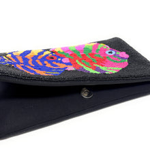 Load image into Gallery viewer, Colorful, beaded clutch with two fish designs. The fish feature vibrant stripes in blue, yellow, pink, green, and orange against a dark background made of seed beads.