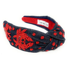 Load image into Gallery viewer, headband featuring red beaded crab motifs on dark denim fabric with a stylish twisted design.