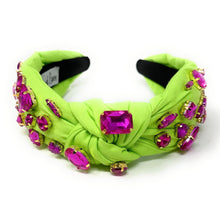 Load image into Gallery viewer, Fashion-forward neon green knot headband featuring bold pink rhinestones and eye-catching embellished styling.