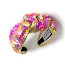 Load image into Gallery viewer, orange, pink and yellow neon sequins headband with a knot design, adorned with multicolored sequins. The vibrant accessory has a playful and chic aesthetic.