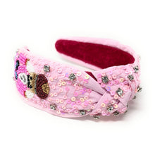 Load image into Gallery viewer, Pink nutcracker knot headband adorned with intricate beadwork, sequins, and rhinestones.