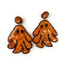 Load image into Gallery viewer, Orange ghost earrings decorated with sequins and black seed beads on a white background. The playful design conveys a fun, festive, and whimsical Halloween theme.