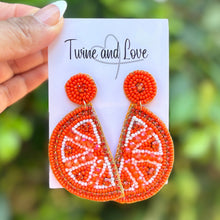 Load image into Gallery viewer, Hand beaded orange slice earrings with citrus design on display card