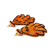 Load image into Gallery viewer, Orange ghost earrings decorated with sequins and black seed beads on a white background. The playful design conveys a fun, festive, and whimsical Halloween theme.
