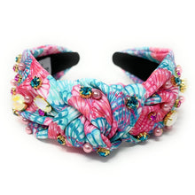 Load image into Gallery viewer, Tropical floral knot headband embellished with colorful gemstones, pearl accents, and vibrant pink and aqua patterns.