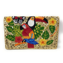 Load image into Gallery viewer, A rectangular clutch purse covered in gold sequins, featuring a vibrant beaded design of tropical birds, flowers, and leaves on the front.