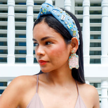 Load image into Gallery viewer, Chic accessory look with a decorated denim headband featuring crystal and travel-themed embellishments.