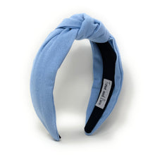Load image into Gallery viewer, Classic light blue knot headband crafted from textured fabric for a chic everyday look.