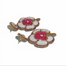 Load image into Gallery viewer, Floral earrings with pink centers and gold accents on a white background