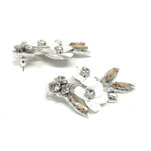 Load image into Gallery viewer, Lightweight floral drop earrings featuring layered white petals, sparkling rhinestones, and artisan-inspired embellishments for a sophisticated finish.