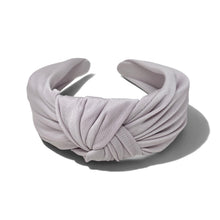 Load image into Gallery viewer, A light lavender satin headband with a knotted twist detail, displayed on a clean white background with a soft shadow.