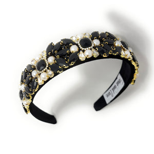 Elegant black headband adorned with clusters of white pearls and black crystals, creating a luxurious and sophisticated look.