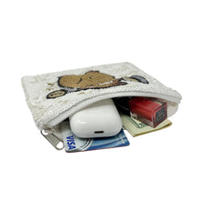 Load image into Gallery viewer, White sequined pouch with a cute capybara lifting weights design.