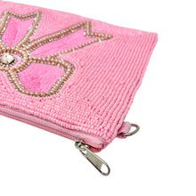 Load image into Gallery viewer, Beaded pink pouch with oversized bow motif and textured hand-beaded surface.