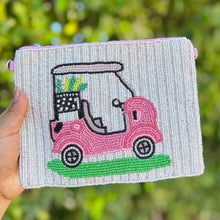 Load image into Gallery viewer, Hand-beaded pouch featuring a pink golf cart design with clubs on a white beaded background.