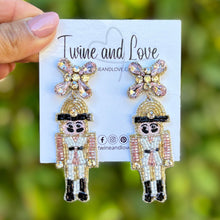 Load image into Gallery viewer, Pink Nutcracker Beaded Earrings, Christmas Earrings, Holiday Earrings, Christmas Beaded Earrings, Seed Bead, Merry Christmas, Pink Nutcracker soldier earrings, pink beaded earrings, Christmas beaded earrings, pink bead earrings, Pink holiday earrings, holiday earrings, Nutcracker earrings, Pink earrings, holiday gifts, holiday accessories, holiday beaded accessories, Holiday Pink accessories, Holiday Christmas earrings, Christmas gifts, Best seller, best Selling items, Christmas earrings, Custom earrings