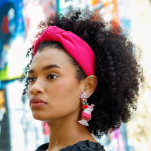 Load image into Gallery viewer, Fashion portrait featuring a bold hot pink headband, statement earrings, and an elegant black outfit.