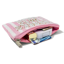 Load image into Gallery viewer, Pink pouch with floral pattern containing stationery items on a white background